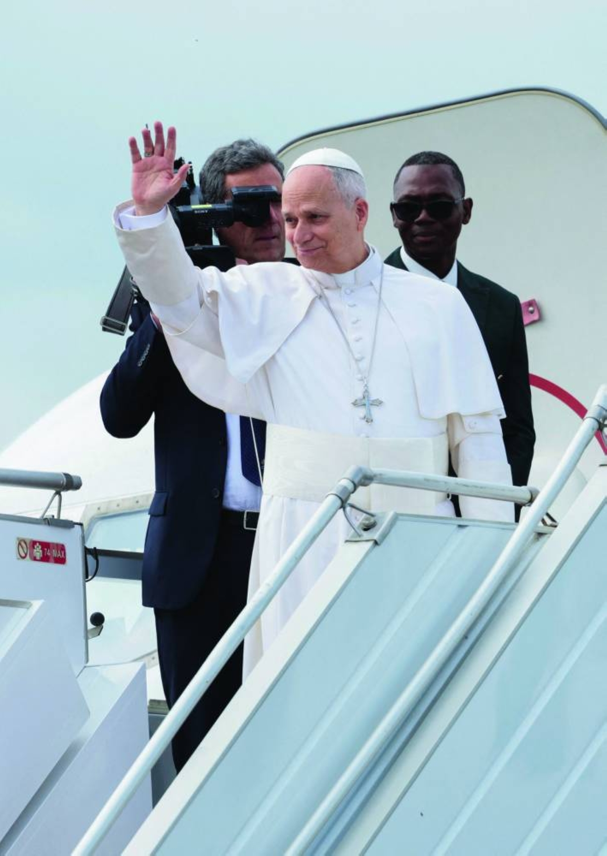 Pope Leo XIV waves as he boards a plane bound for Bamenda, at Yaounde Nsimalen International Airport, Cameroon. – Reuters