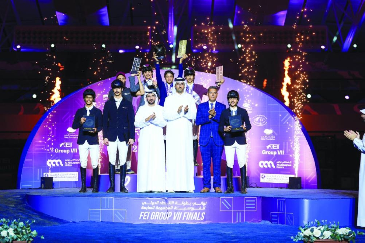  


Sultan Mohammed Al Yahyaei, President of Regional Group VII of the International Equestrian Federation, and Sheikh Talal bin Khalid Al Thani, the tournament director pose with the podium winners at Al Shaqab.