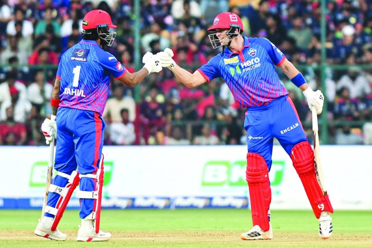 Delhi Capitals’ Tristan Stubbs (right) bumps his fists with teammate KL Rahul during the IPL match against Royal Challengers Bengaluru at the M Chinnaswamy Stadium in Bengaluru Saturday. (AFP)