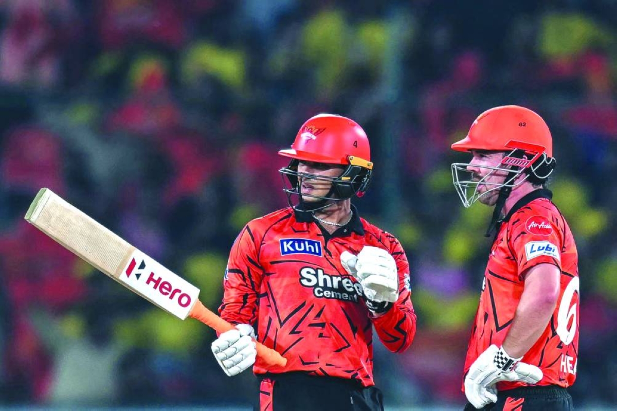 Sunrisers Hyderabad’s Travis Head (right) and his Indian teammate Abhishek Sharma speak during the IPL match against Chennai Super Kings in Hyderabad Saturday. (AFP)