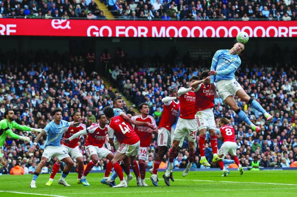 
Manchester City’s Erling Haaland (right) heads the ball during the Premier League match against Arsenal at the Etihad Stadium in Manchester. (AFP) 
