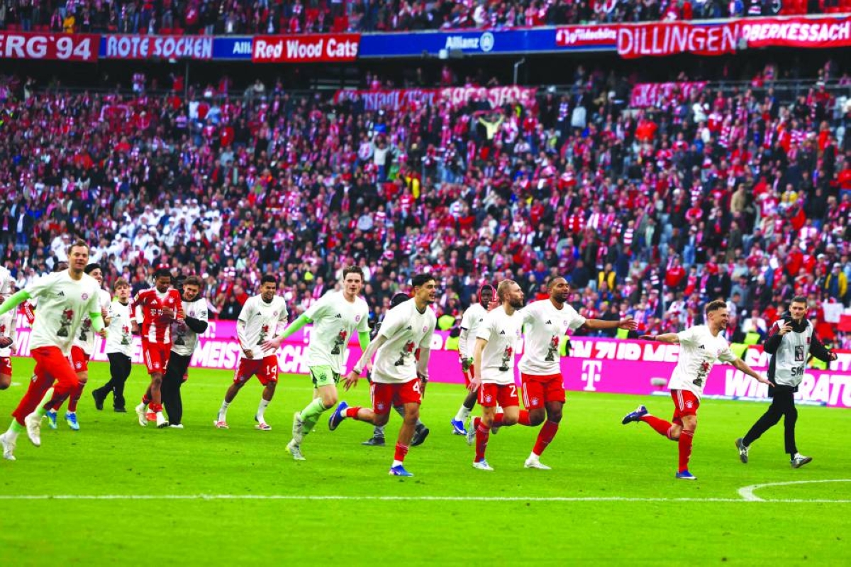 Bayern Munich players celebrate in Munich Sunday, after winning the Bundesliga for a record-extending 35th time. (AFP)