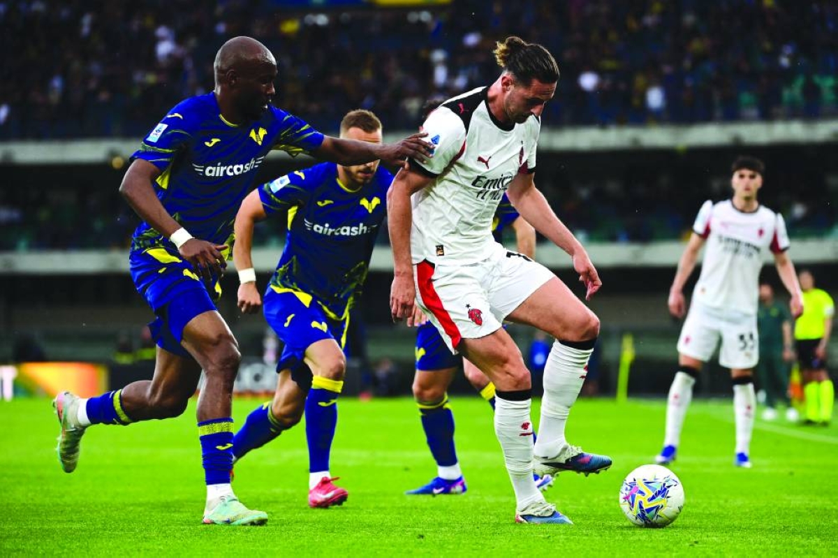 
AC Milan’s Adrien Rabiot (right) fights for the ball with Hellas Verona’s Moatasem al-Musrati during the Serie A match in Verona. (AFP) 