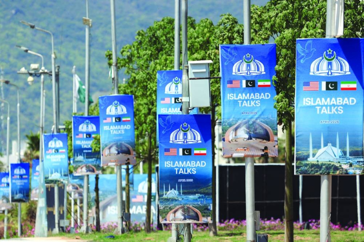Hoardings are mounted on lamp posts as Pakistan prepared Monday to host the US and Iran for a possible second phase of peace talks in Islamabad. (Reuters)