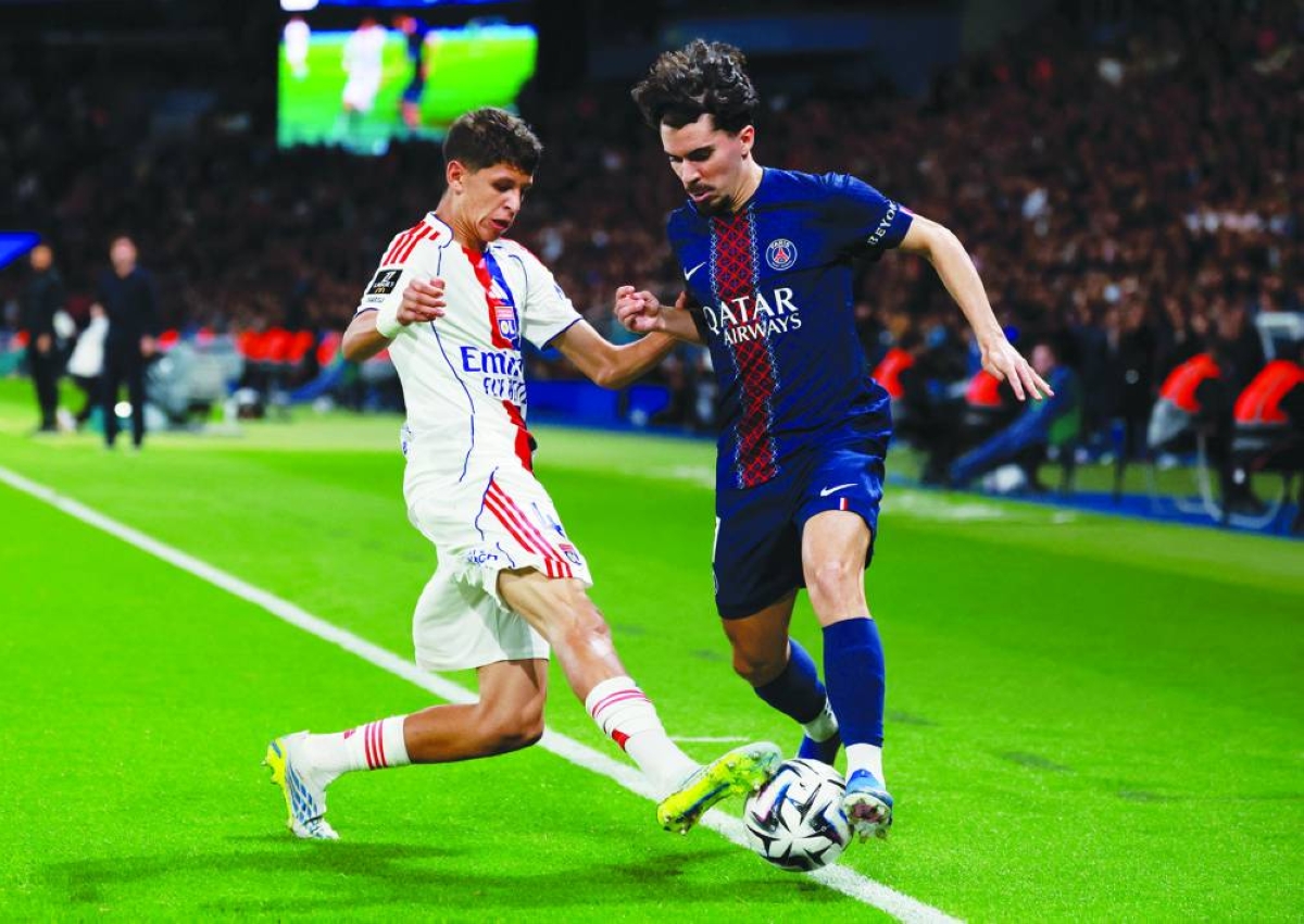 Olympique Lyonnais' Khalis Merah in action with Paris St Germain's Vitinha. REUTERS
Ligue 1 - Paris St Germain v Olympique Lyonnais - Parc des Princes, Paris, France - April 19, 2026
