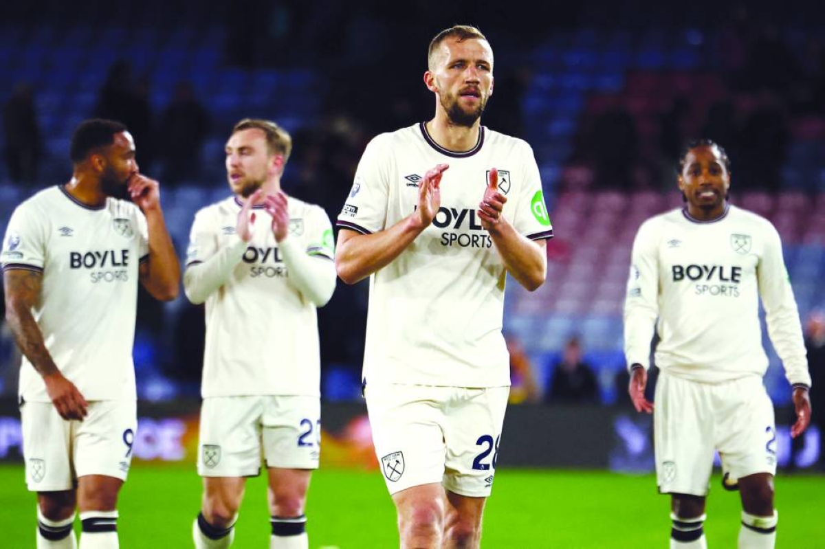 West Ham United's Callum Wilson, Jarrod Bowen, Tomas Soucek and Kyle Walker-Peters applauds the fans following the Premier League match against Crystal Palace at Selhurst Park in south London on April 20, 2026. (AFP)