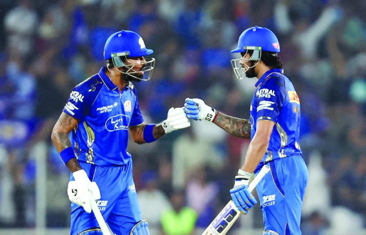 
Mumbai Indians’ Tilak Varma (right) and Hardik Pandya react during their IPL match against Gujarat Titans in Ahmedabad on Monday. (Reuters) 