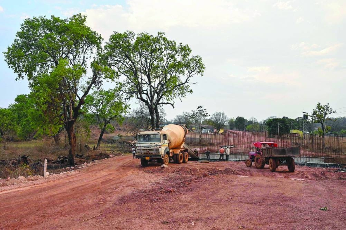 Workers building a road at an under-construction site in Chhattisgarh's Narayanpur. (AFP) 