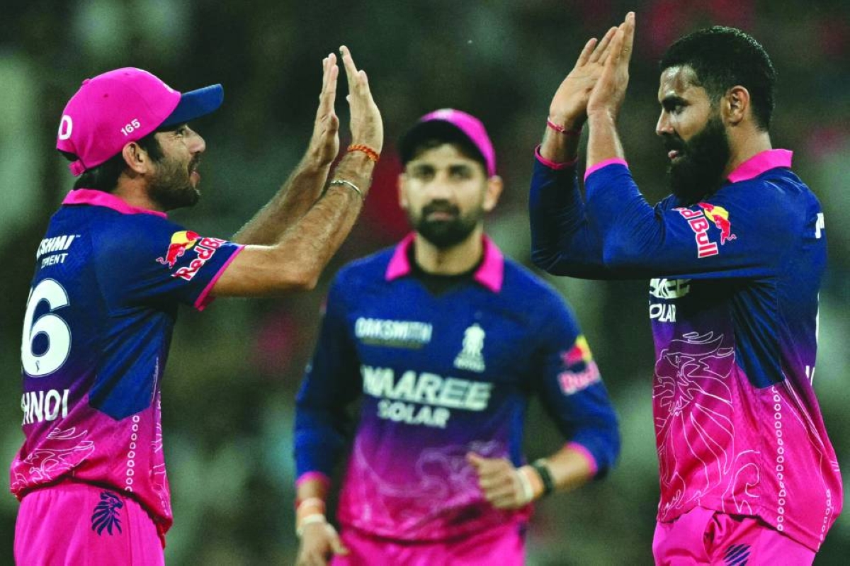 Rajasthan Royals’ Ravindra Jadeja (right) celebrates with teammates after taking the wicket of Lucknow Super Giants’ Nicholas Pooran during the IPL match in Lucknow Wednesday. (AFP)