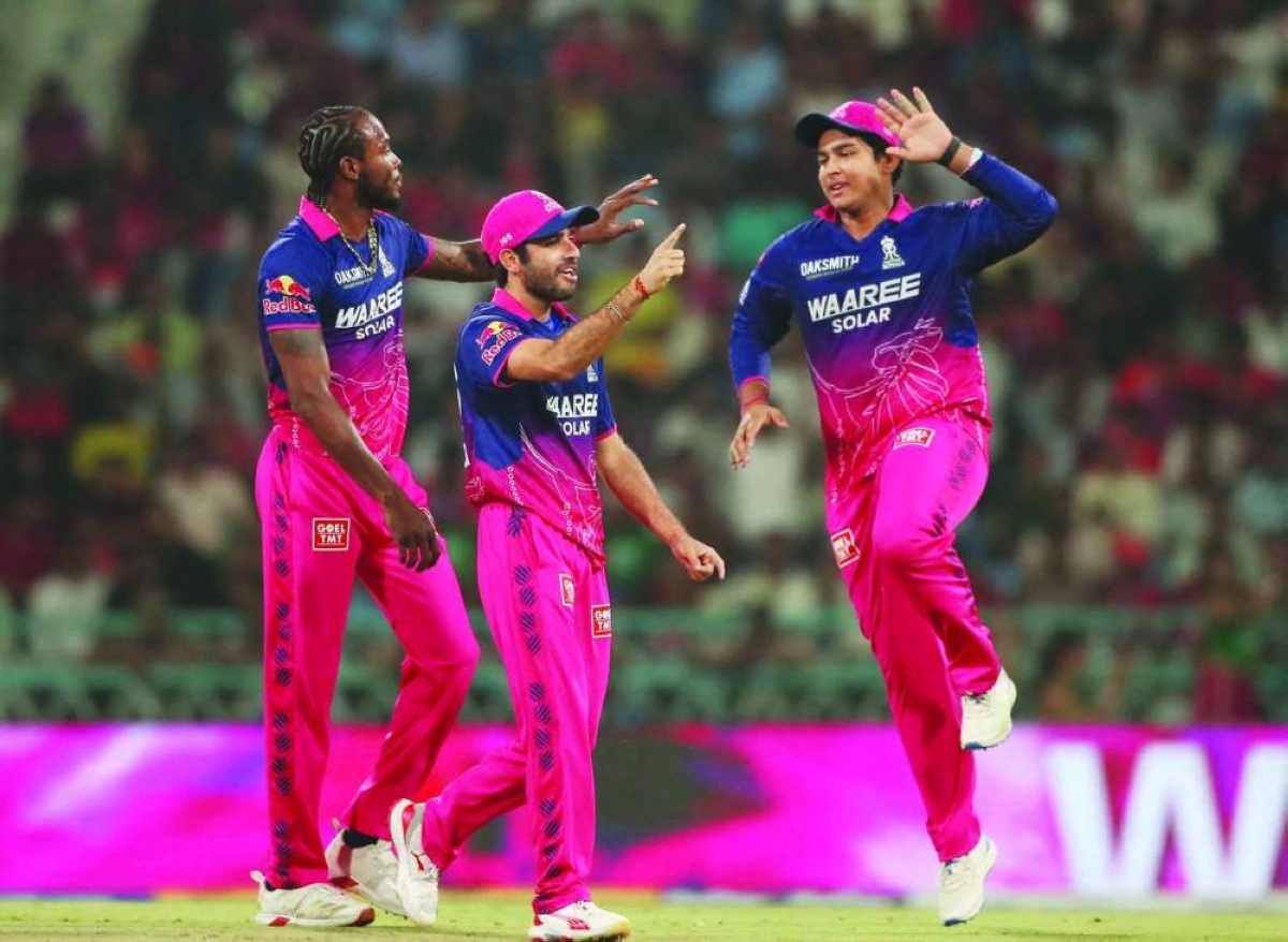 Rajasthan Royals’ Jofra Archer (left) celebrates with teammates Wednesday. (Reuters)