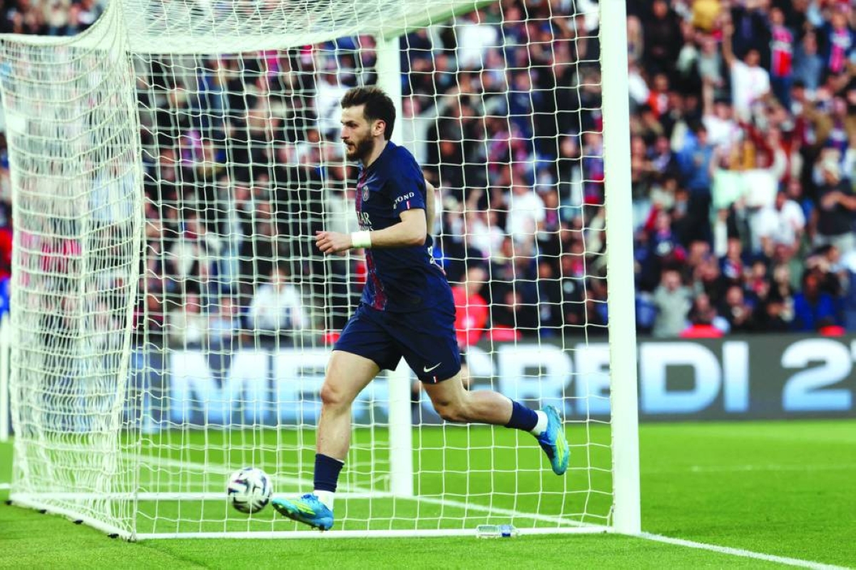PSG’s Khvicha Kvaratskhelia celebrates scoring his team’s third goal during the Ligue 1 match against Nantes at the Parc des Princes stadium in Paris Wednesday. (AFP)