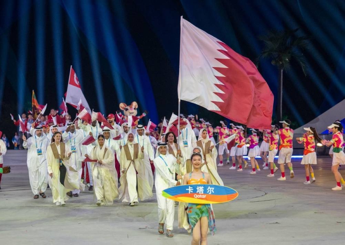 Aquathlon athlete Shaheen al-Kaabi and women's beach volleyball player Haya Abu-Issa carried Qatar's flag at Opening Ceremony. 
