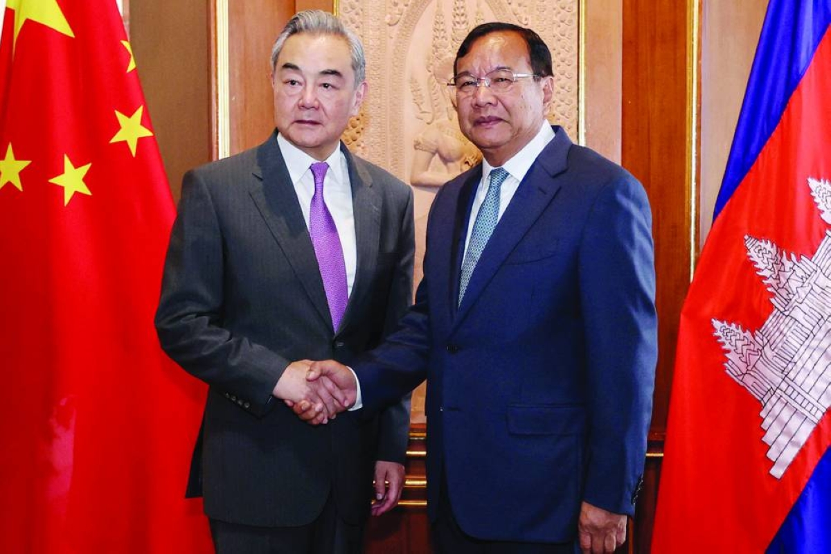 Prak Sokhonn (right), Cambodian Deputy Prime Minister and Minister of Foreign Affairs and International Co-operation, shaking hands with China's Foreign Minister Wang Yi during a meeting at the Ministry of Foreign Affairs in Phnom Penh, Thursday. (AFP)