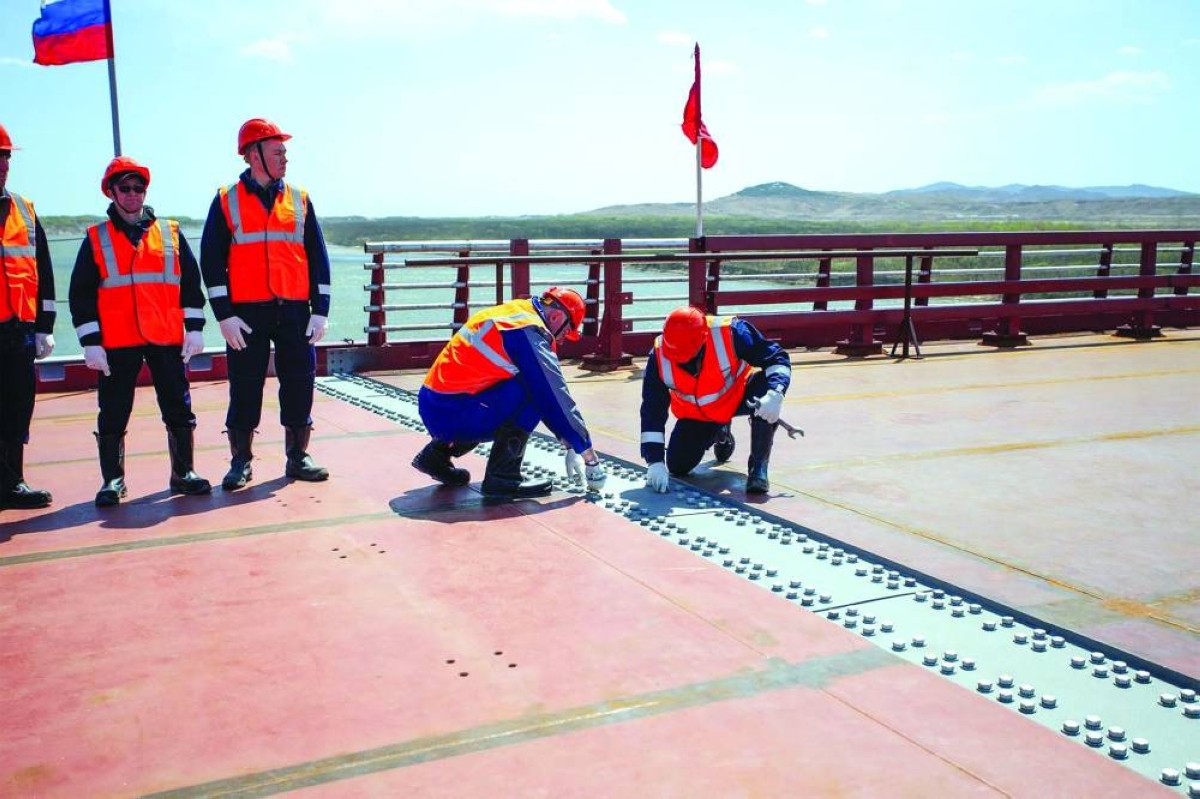 A ceremony marking the connection of the two sides of the new Russia-North Korea road bridge over the Tumen River, set to open this summer. (AFP) 