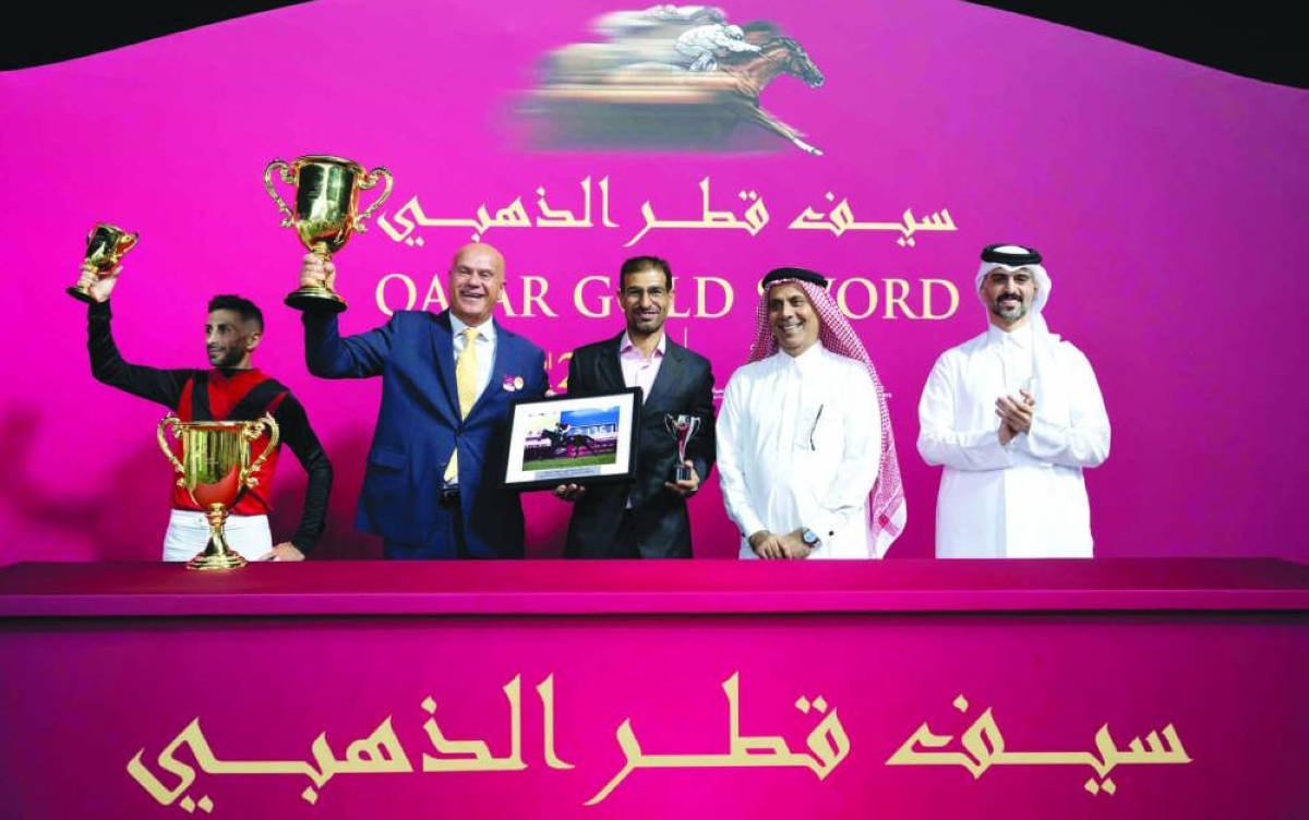 Connections of Sovereign Spirit celebrate after the bay gelding won the Qatar Gold Trophy Thursday.