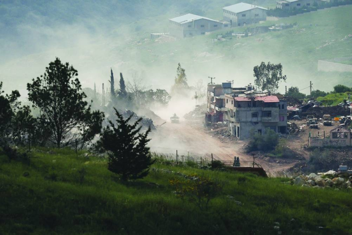 An Israeli military vehicle drives in Lebanon, as seen from the Israeli side of the Israel-Lebanon border, in northern Israel, April 26, 2026. REUTERS