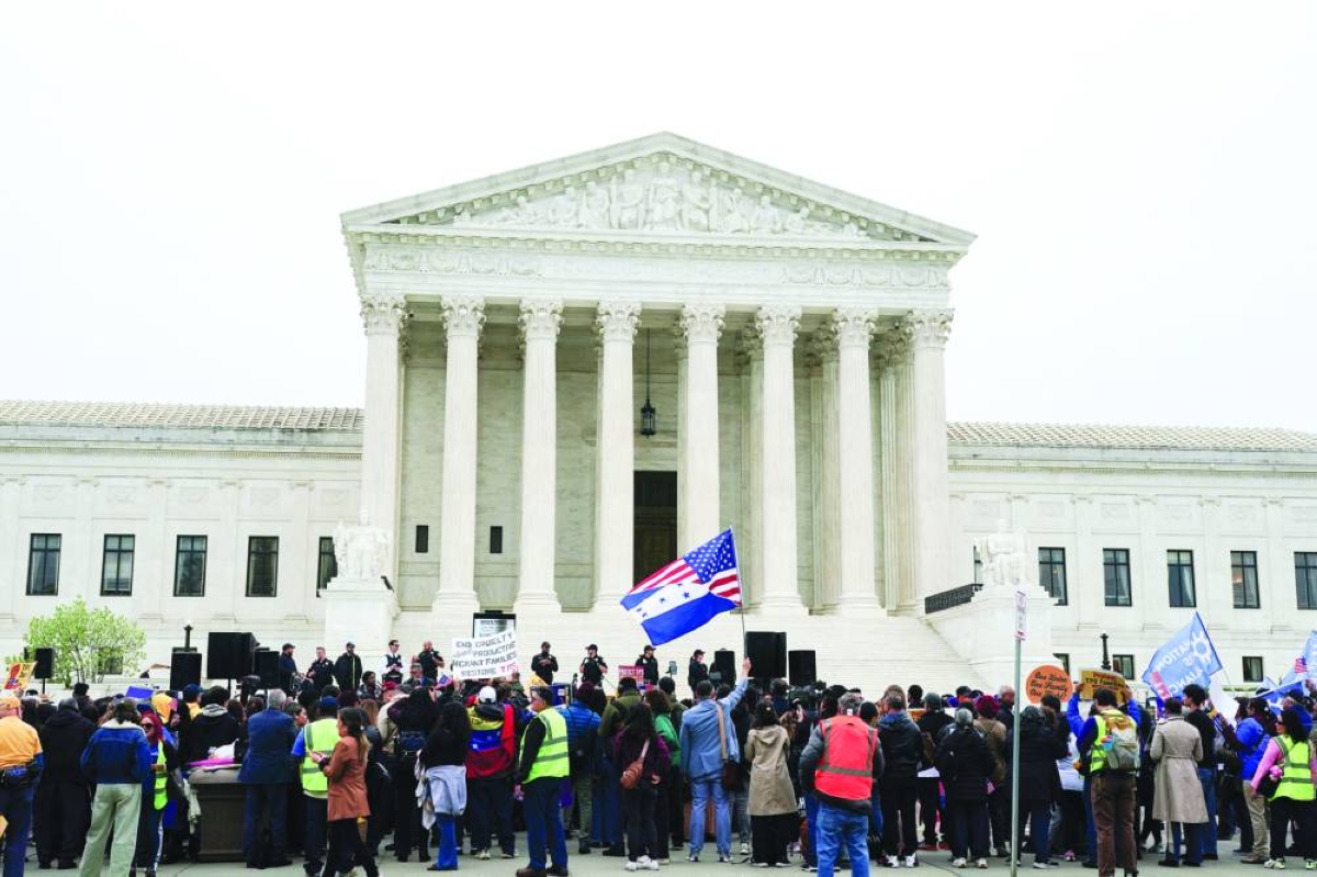 Immigrant rights activists and demonstrators attend a rally outside the US Supreme Court, in Washington, DC, Wednesday. (Reuters)