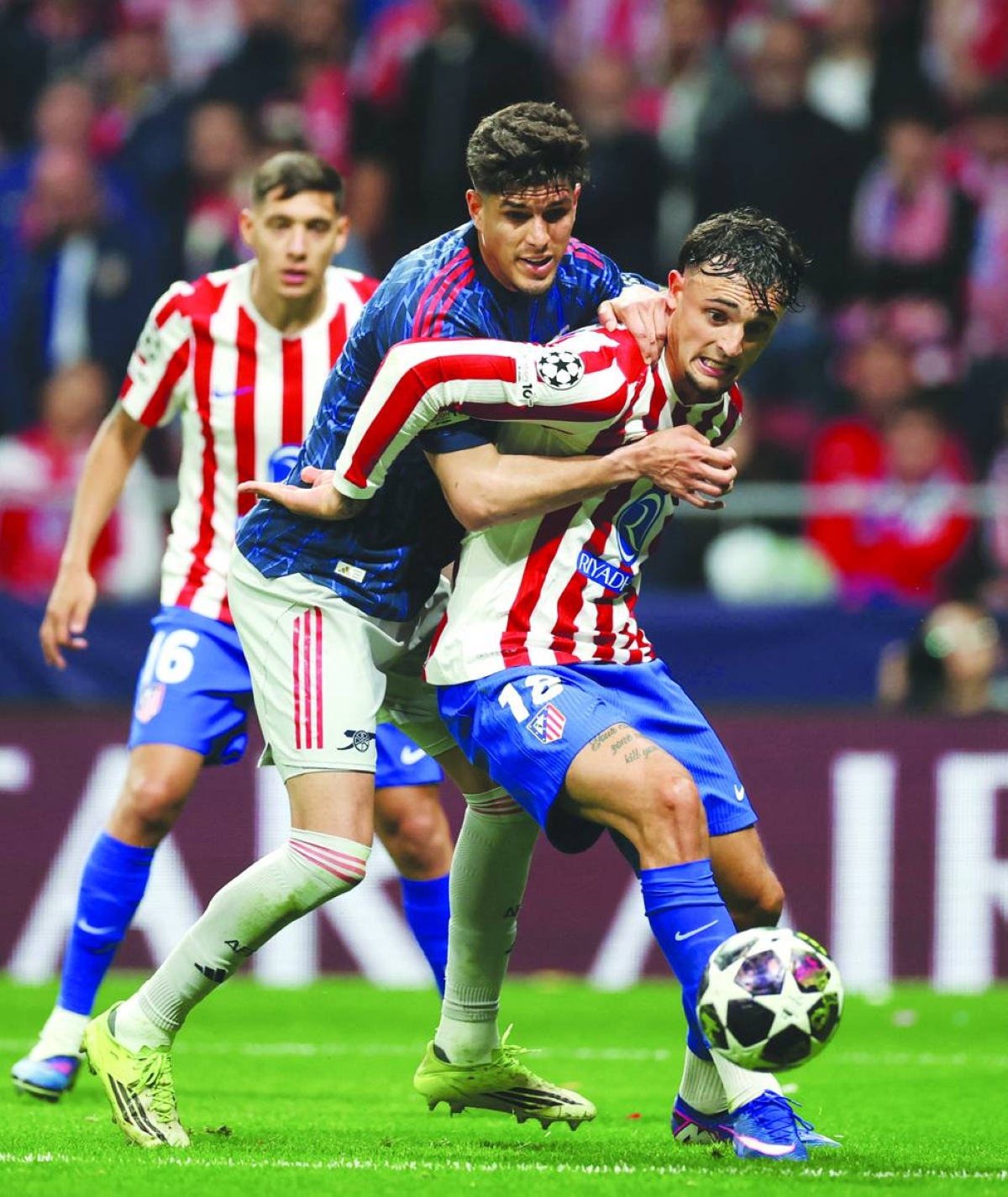 
Atletico Madrid’s Marc Pubill (right) and Arsenal’s Piero Hincapie battle for the ball during the Champions League first leg semi-final in Madrid. (Reuters) 