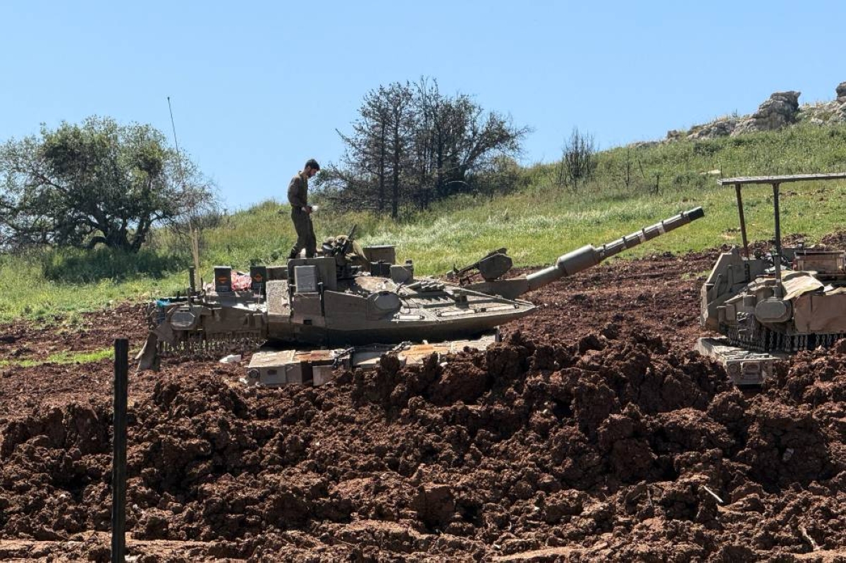 An Israeli soldier stands on tank, on the Israeli side of the Israel-Lebanon border, in northern Israel April 29, 2026. Picture taken with a mobile phone. REUTERS/Avi Ohayon