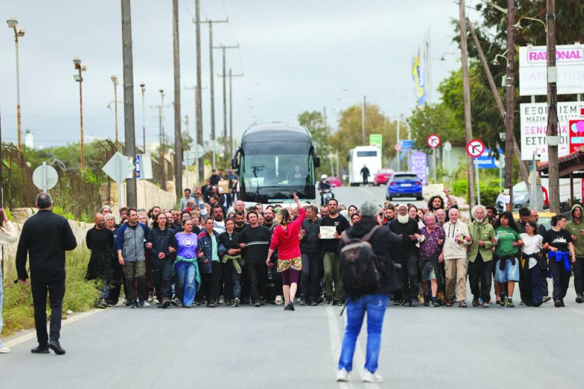 Activists from the Global Sumud Flotilla, which was intercepted on international waters by the Israeli navy, walk towards the airport of Heraklion, on the island of Crete, Greece. – Reuters