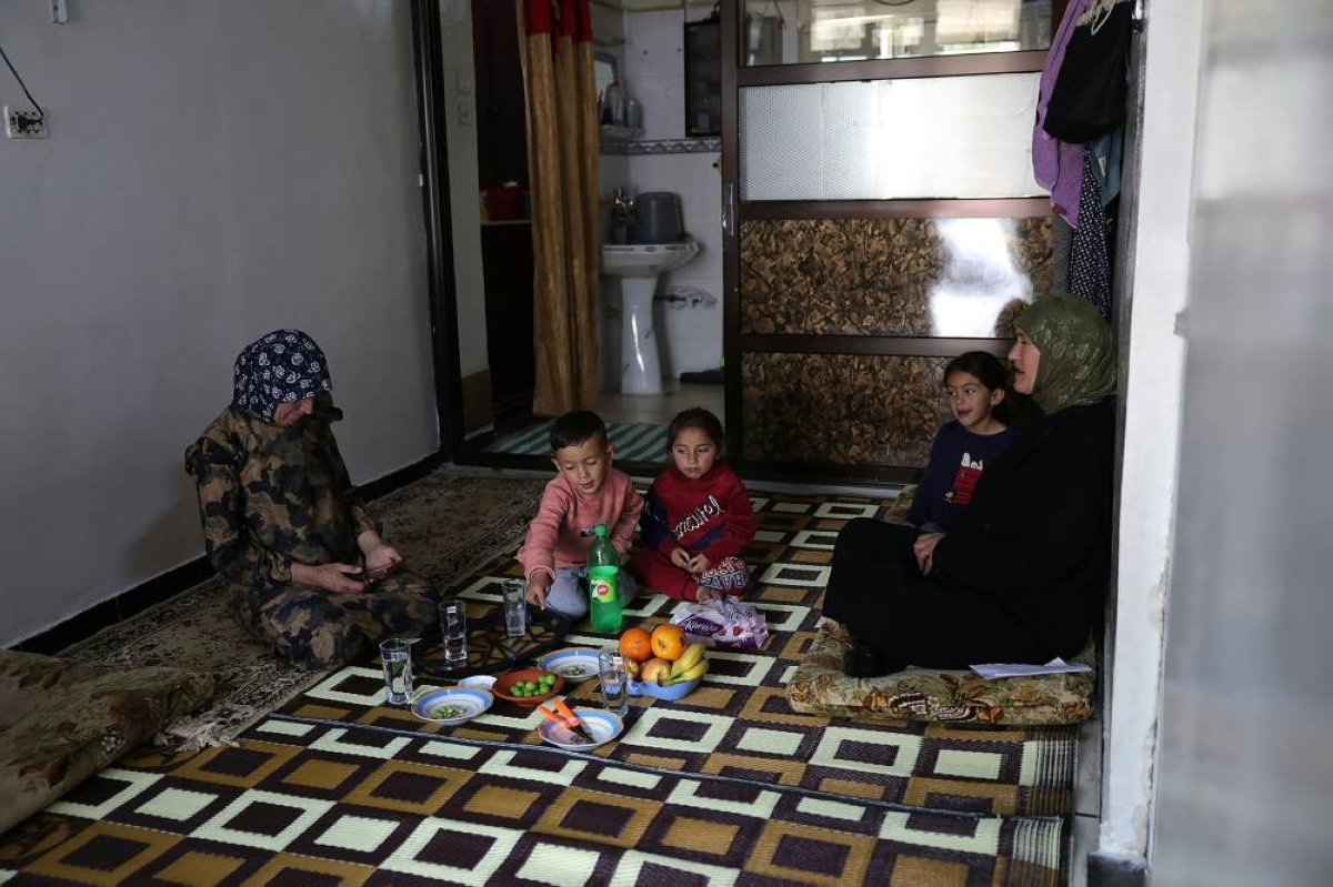 Fatima al-Safadi sits in her house with her grandchildren whose father was detained by Israel, in the southern Syrian village of Bayt Jinn, near the Israeli-annexed Syrian Golan Heights and at the foot Mount Hermon, known in Arabic as Jabal al-Sheikh. – AFP