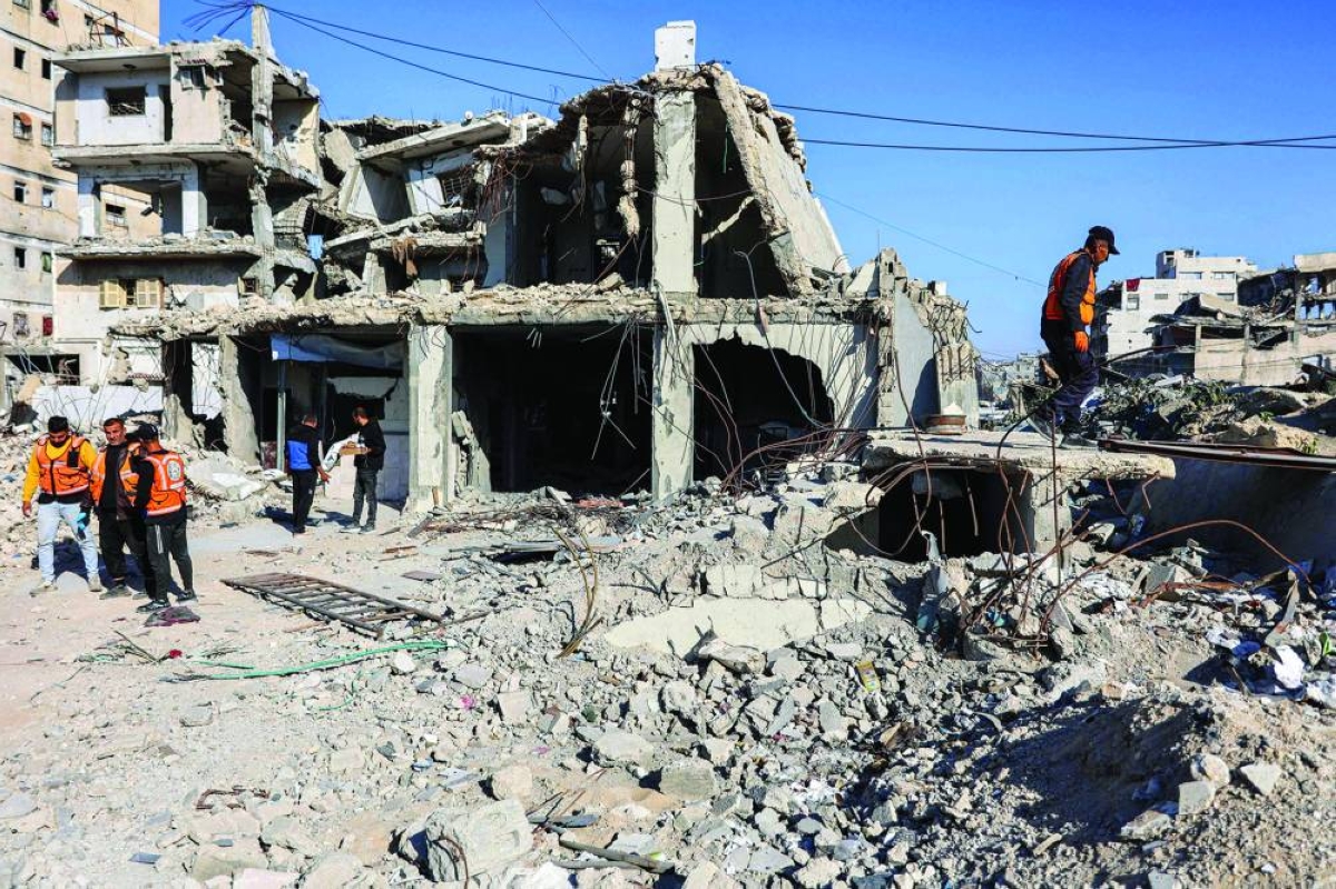 First responders inspect the site of an Israeli strike on a police station in Gaza City on May 5, 2026. (AFP)