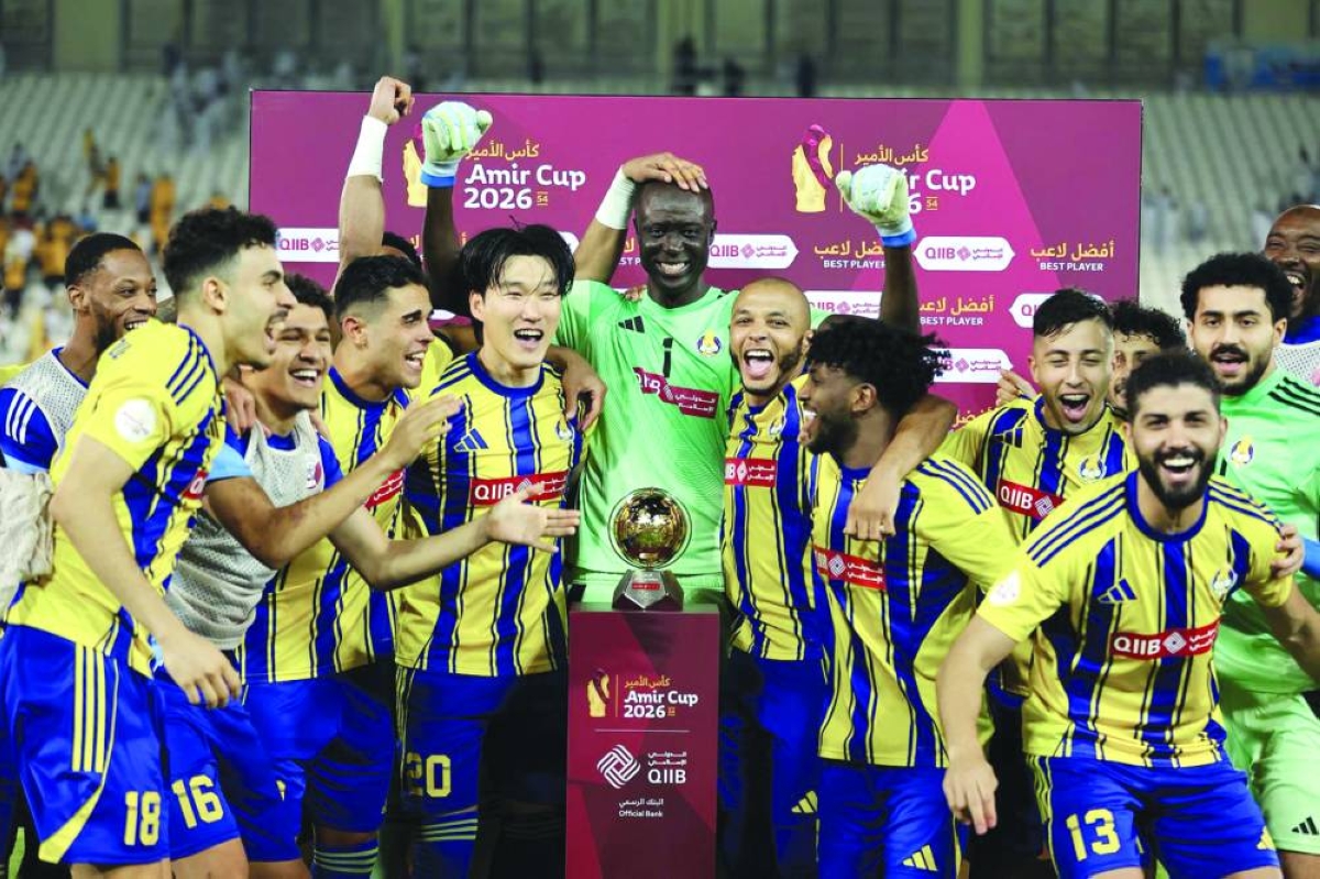 Al Gharafa’s goalkeeper Khalifa Abubakar (centre), who was named man of the match, celebrates with his team-mates after the penalty shootout win over Al Wakrah at Jassim Bin Hamad Stadium Tuesday.