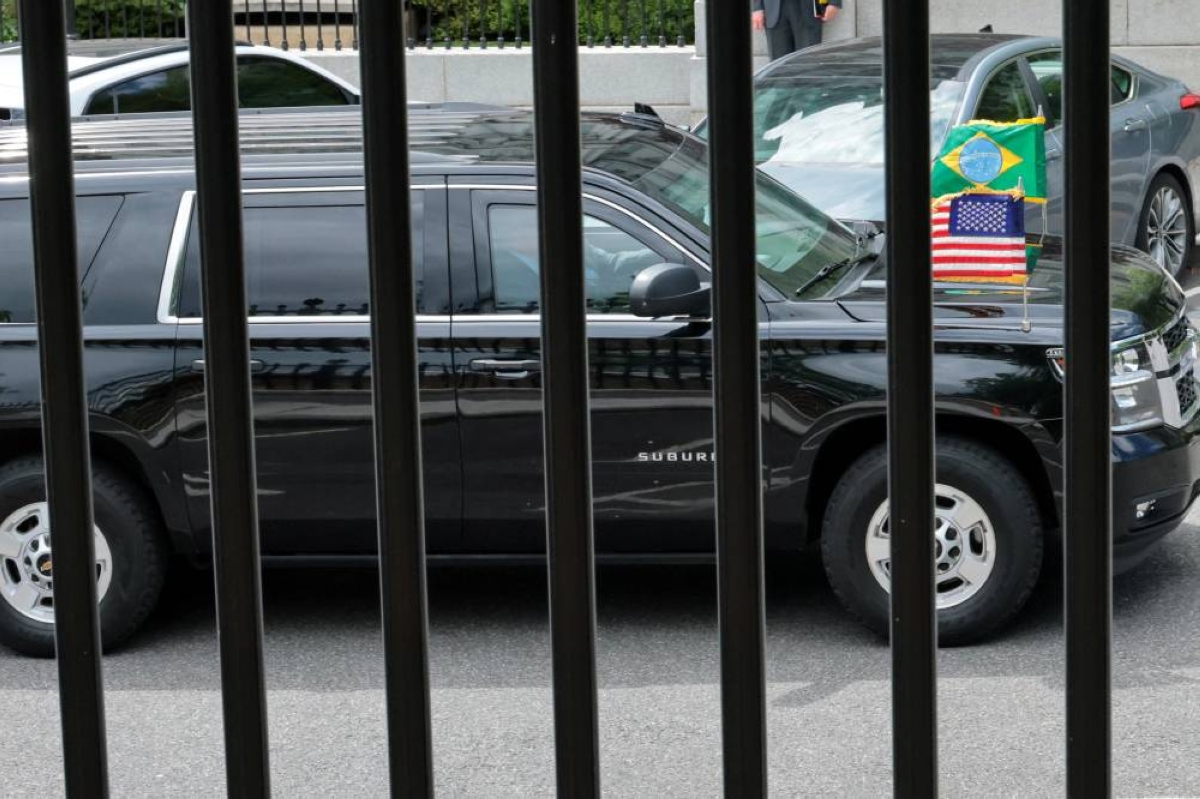The vehicle carrying Brazilian President Luiz Inacio Lula da Silva departs after meeting US President Donald Trump, without an expected photo opportunity with reporters in the Oval Office, at the White House in Washington, DC, yesterday. (Reuters)