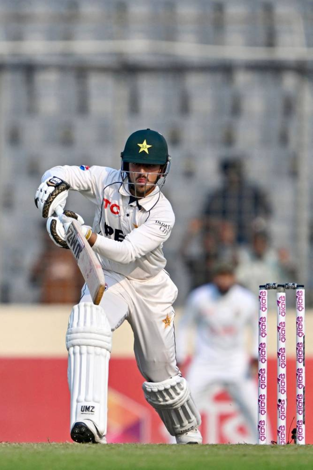 Pakistan's Azan Awais plays a shot during the second day of the first Test cricket match between Bangladesh and Pakistan at the Sher-e-Bangla National Stadium in Mirpur on May 9, 2026. (AFP)