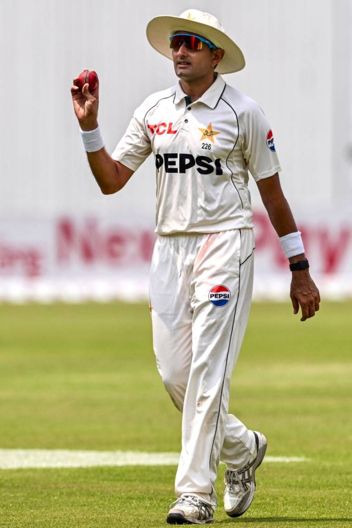 Pakistan's Mohammad Abbas acknowledges spectators after taking a five-wicket haul during the second day of the first Test cricket match between Bangladesh and Pakistan at the Sher-e-Bangla National Stadium in Mirpur on May 9, 2026. (AFP)