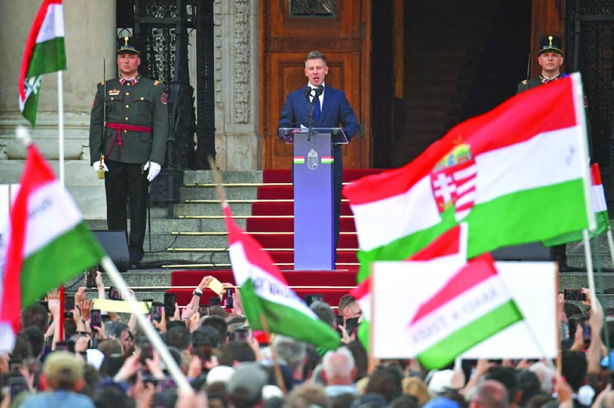 Hungary's incoming Prime Minister Peter Magyar delivers a speech outside the Hungarian parliament after his swearing-in ceremony in Budapest on May 9, 2026. Lawmakers in Hungary on May 9, 2026 swore in pro-European conservative Peter Magyar as the country's new prime minister, after elections last month that ended Viktor Orban's 16 years in power. The parliament formally elected Magyar with 140 votes for, 54 against, and one abstention in the inaugural session of the new chamber resulting from the April polls. (AFP)