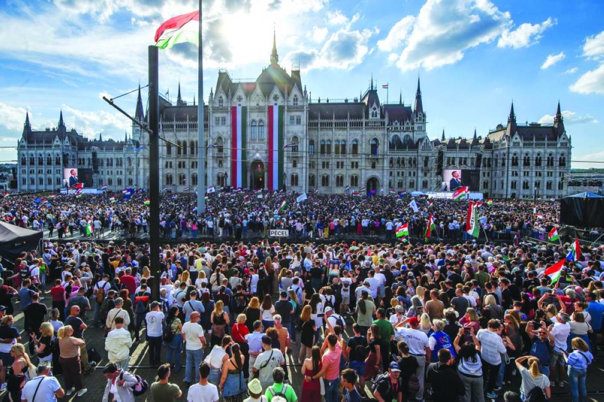 People attend Hungary's incoming Prime Minister Peter Magyar's swearing-in ceremony outside the Hungarian parliament in Budapest on May 9, 2026. (AFP)