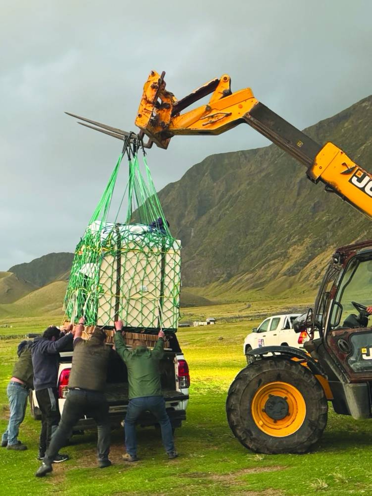 Members of the UK Armed Forces help with medical kit dropped to the Atlantic Island of Tristan Da Cunha. (AFP)
