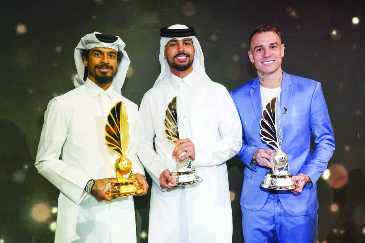 Al Sadd's Akram Afif (left), Al Rayyan’s Mahmoud Abunada (centre) and Al Rayyan's Roger Guedes with their trophies at the QFA Awards ceremony held at Raffles Hotel Doha on Monday. Afif won the Best Player award for the sixth time. Abunada won the Best Goalkeeper award while Guedes clinched the Mansour Muftah Award for being the top scorer (21 goals) in the 2025-26 season.