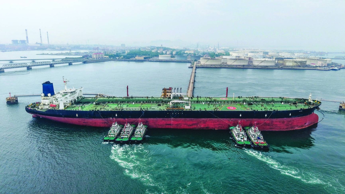 
A cargo ship unloads imported crude oil at the Qingdao crude oil terminal in China’s eastern Shandong province. (AFP) 