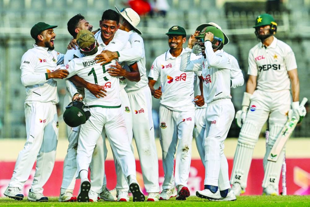 Bangladesh's Nahid Rana (3L) celebrates with teammates their team's win at the end of the fifth day of the first Test cricket match between Bangladesh and Pakistan at the Sher-e-Bangla National Stadium in Mirpur on May 12, 2026. (AFP)