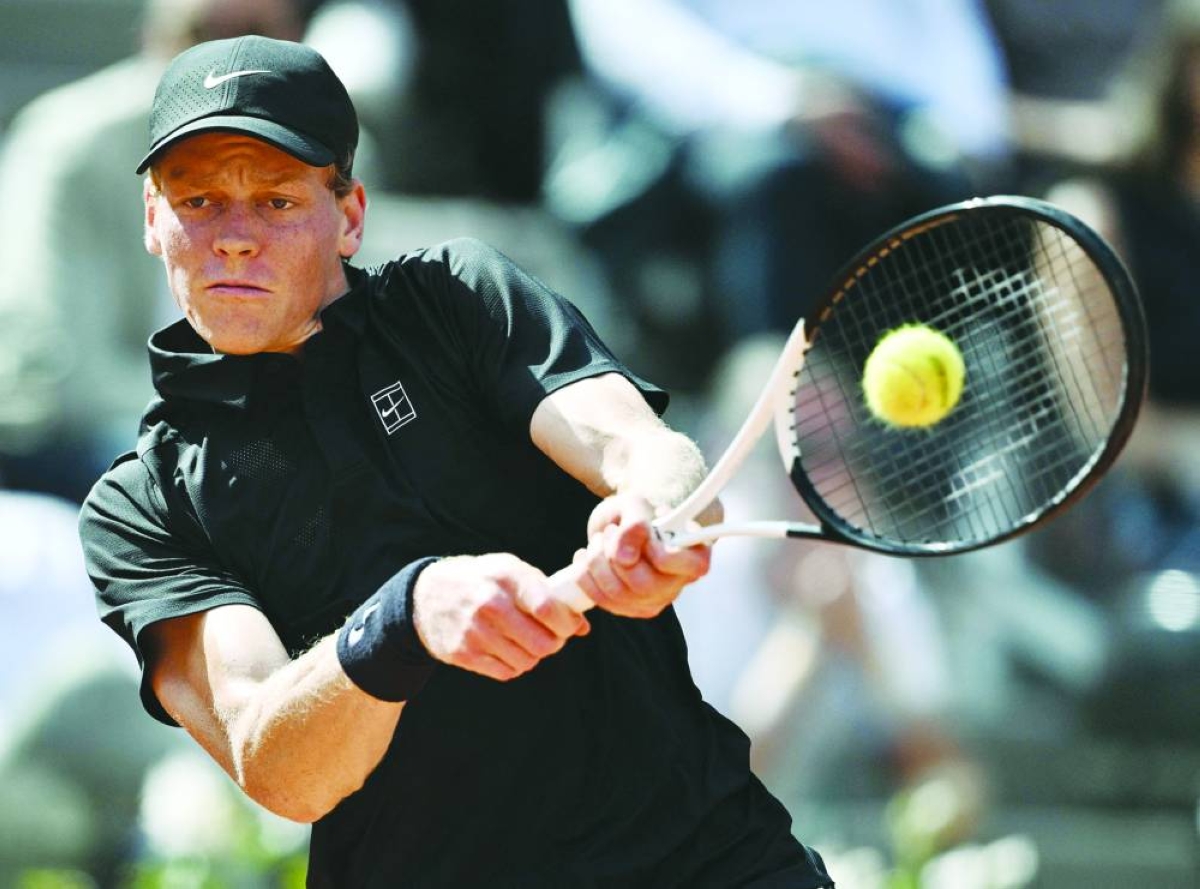 Italy's Jannik Sinner hits a return to Italy's Andrea Pellegrino during the ATP Rome Open tennis tournament at Foro Italico in Rome on May 12, 2026. (AFP)