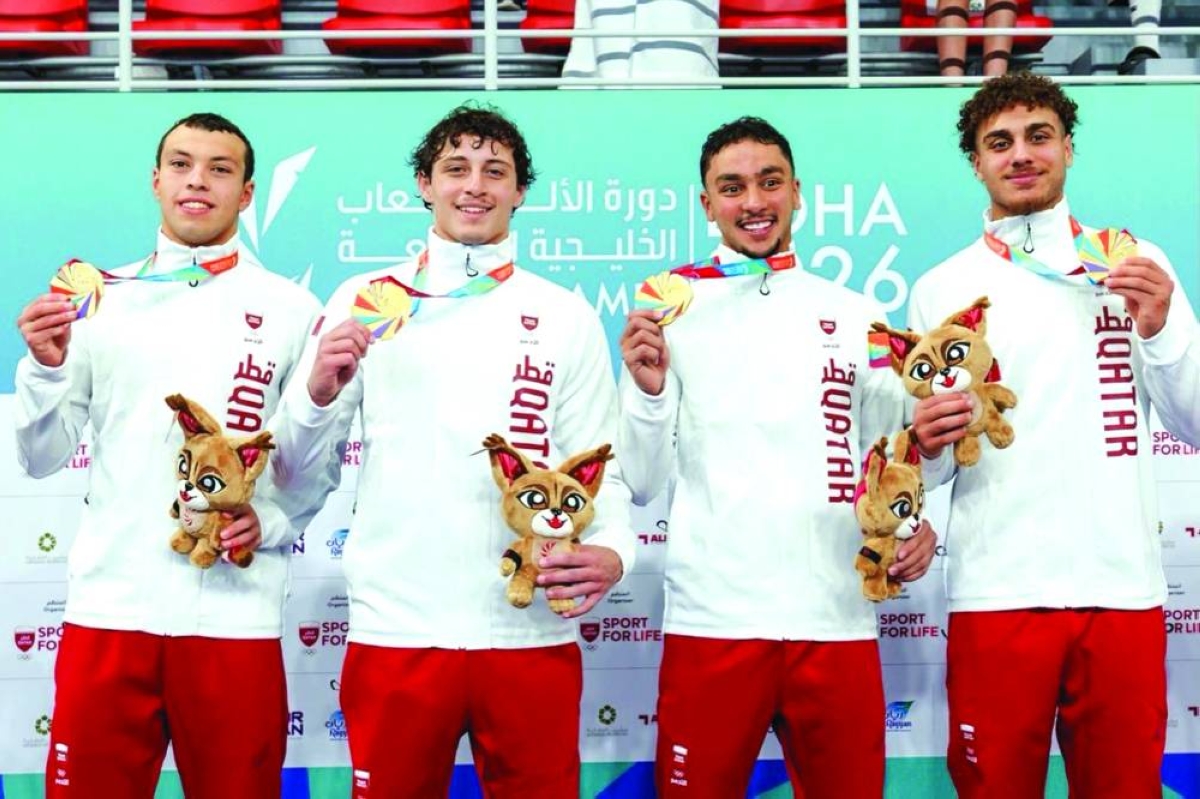 Qatar's 4x100m freestyle relay team pose with their gold medals at the 4th GCC Games Doha at Hamad Aquatics Centre.