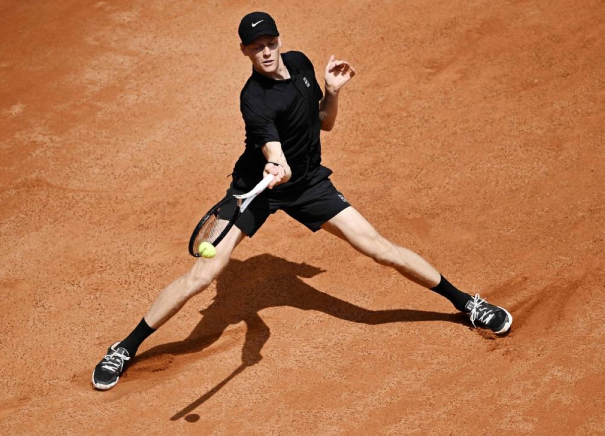 Italy's Jannik Sinner hits a return to Russia's Andrey Rublev during the Italian Open at Foro Italico in Rome on May 14, 2026. (AFP)