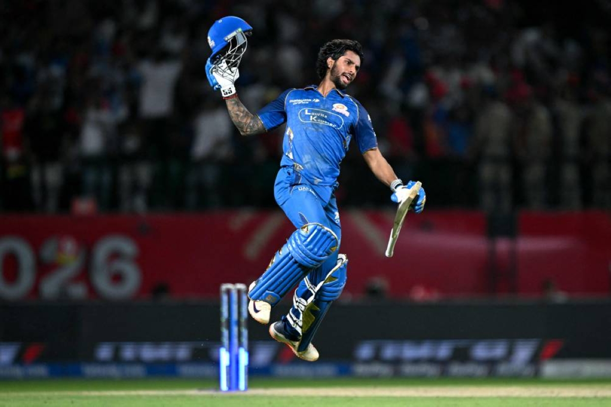 Mumbai Indians' Tilak Varma celebrates after leading his team's to victory against Punjab Kings in the Indian Premier League (IPL) at the Himachal Pradesh Cricket Association Stadium in Dharamsala. (AFP)