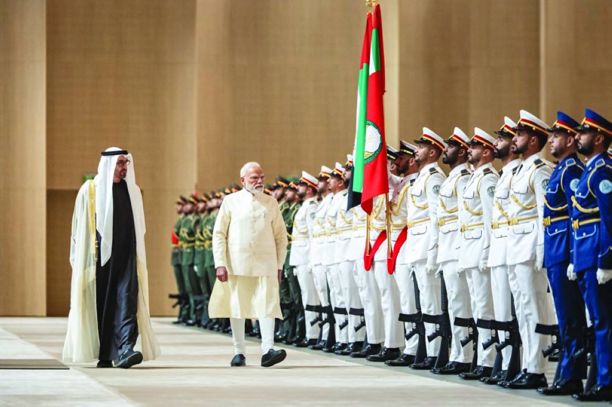 President of the United Arab Emirates Mohamed bin Zayed al-Nahyan and Indian Prime Minister Narendra Modi inspect the UAE Armed Forces honour guards during an official visit at the Presidential Airport, in Abu Dhabi, yesterday. (Reuters)