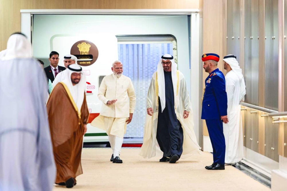 President of the United Arab Emirates Mohamed bin Zayed al-Nahyan receives Indian Prime Minister Narendra Modi during an official visit at the Presidential Airport, in Abu Dhabi, yesterday. (Reuters)