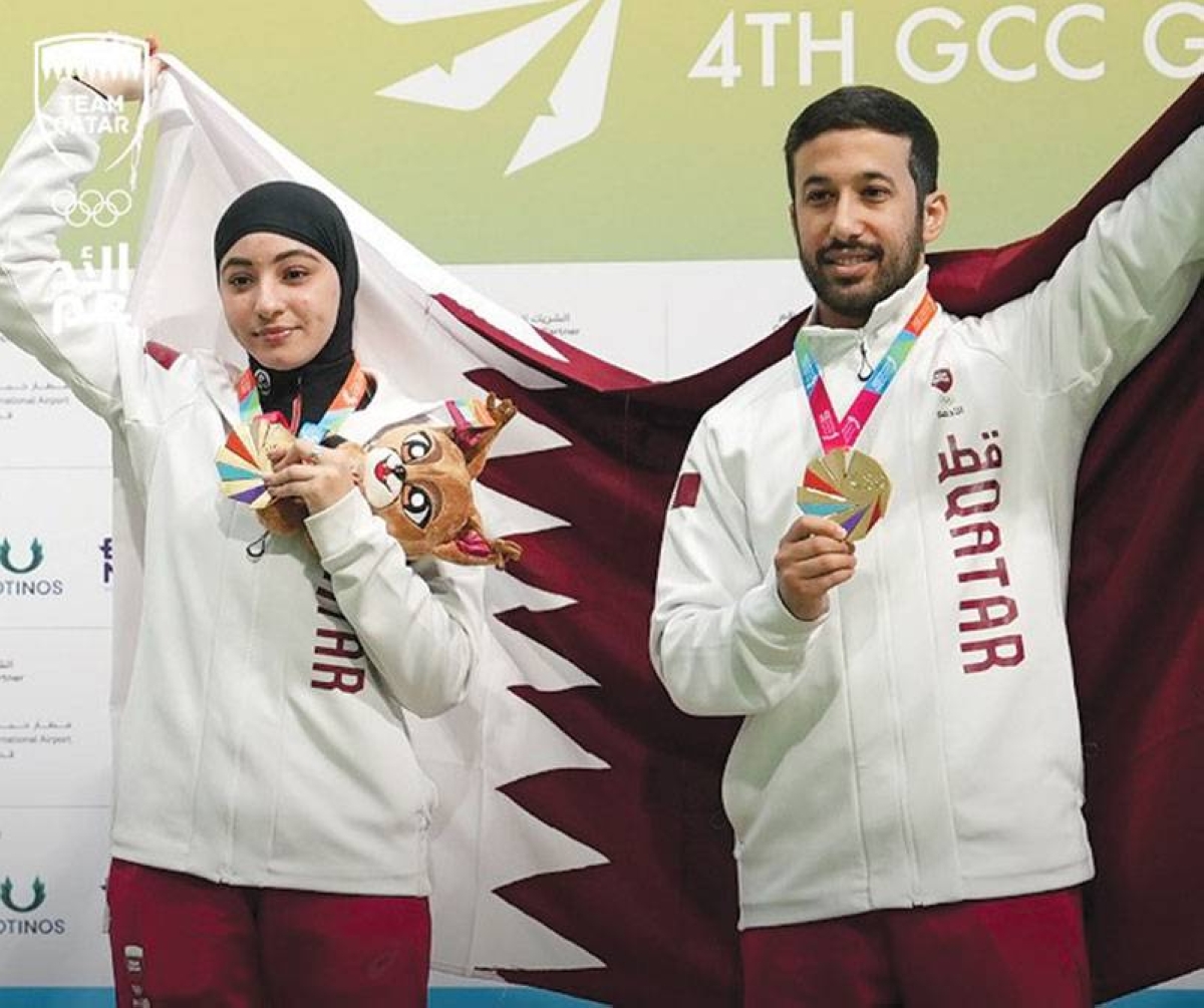 Abdullah al-Sunaidi and Al-Maha al-Ali celebrate winning the gold in the 10m rifle mixed team.
