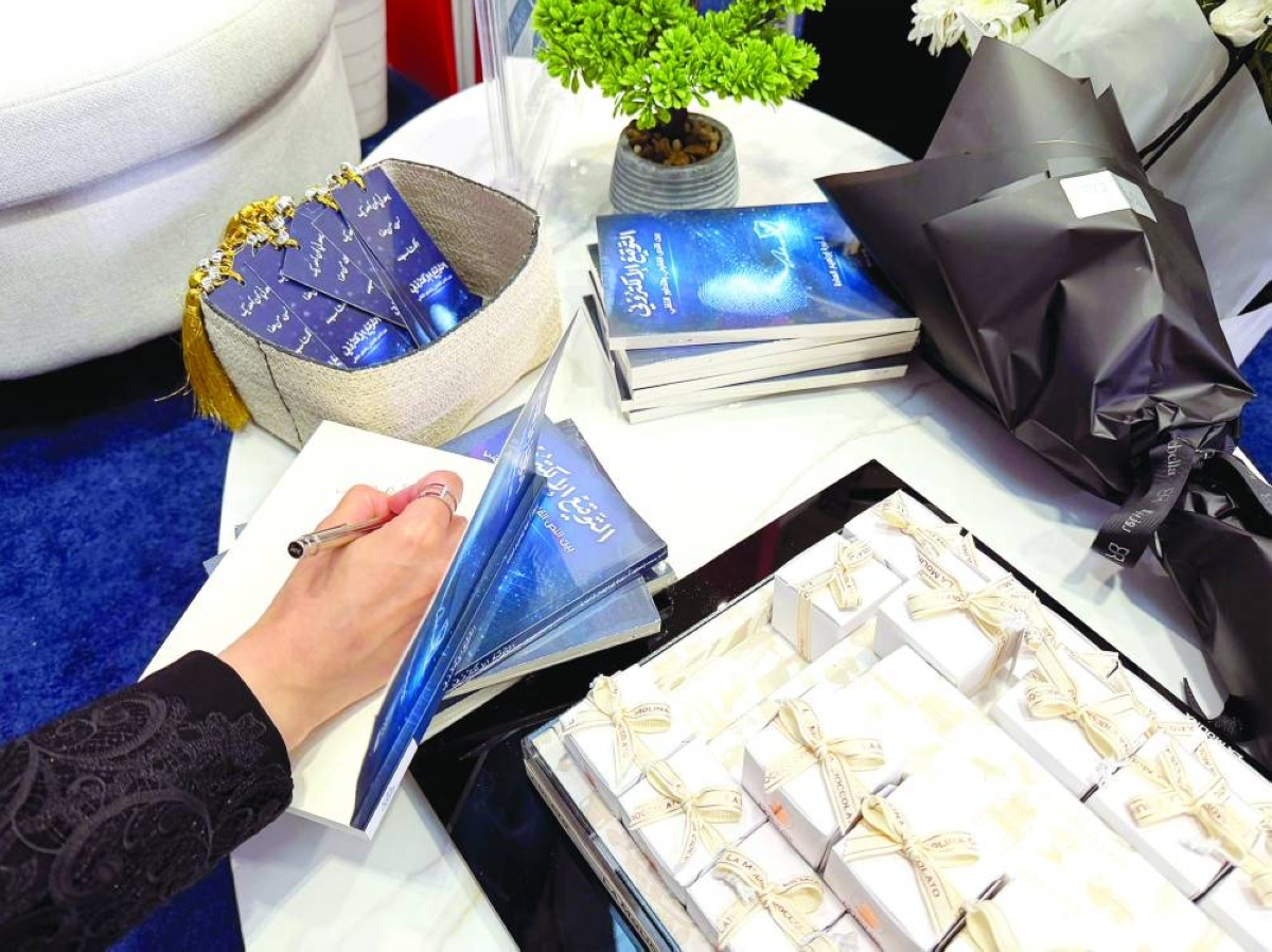 Noura al-Sada signing her book