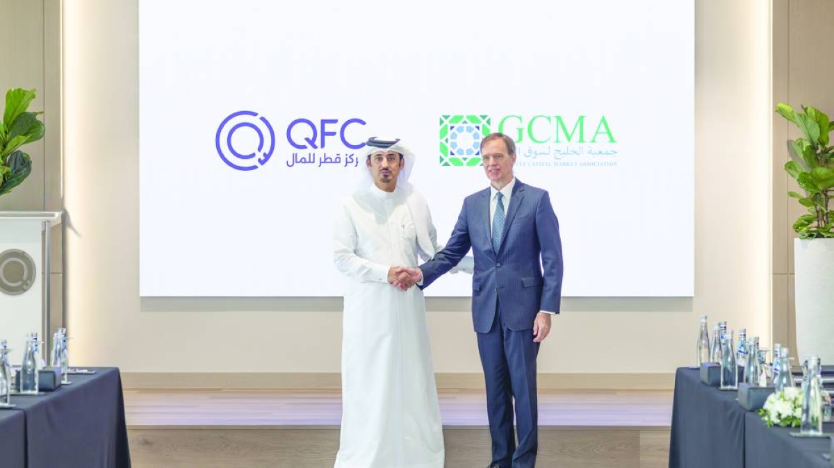 QFC CEO Mansoor Rashid al-Khater shaking hands with GCMA president Michael Grifferty.