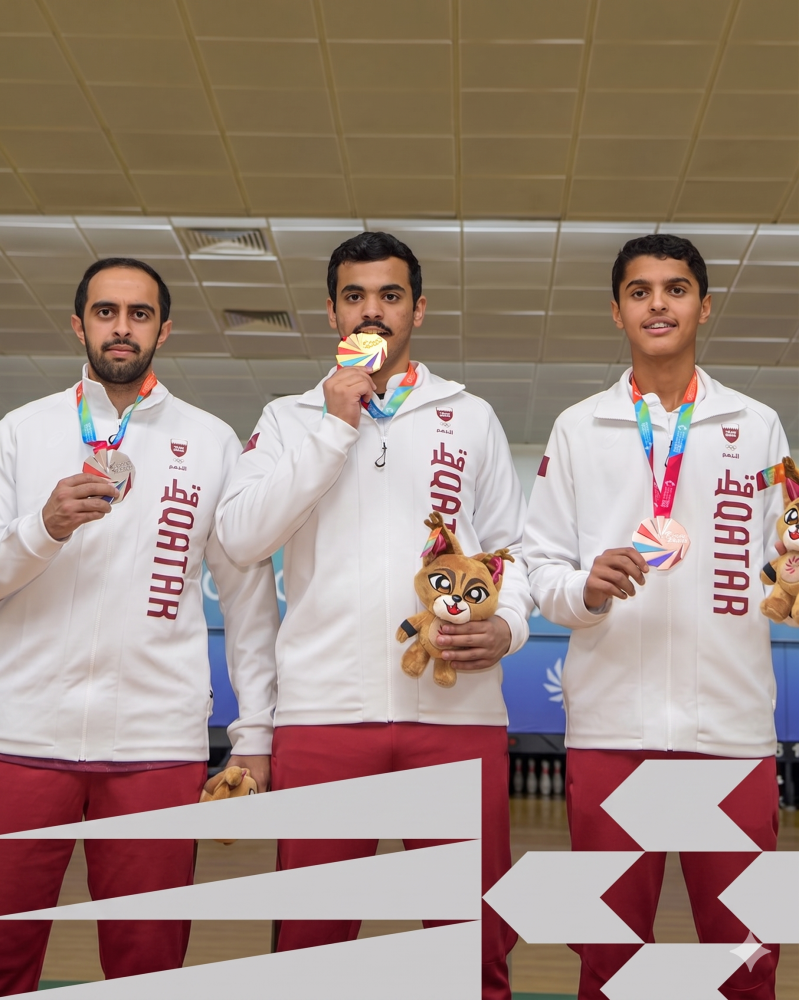 Qatar's Badr al-Sada, Jassim al-Marri and Talal al-Marri after winning the top three positions in the men's overall team bowling competition. 