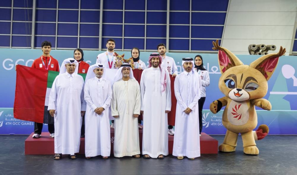 Qatar Table Tennis Association president Hamad al-Hammadi with players with medals in the mixed doubles final. 
