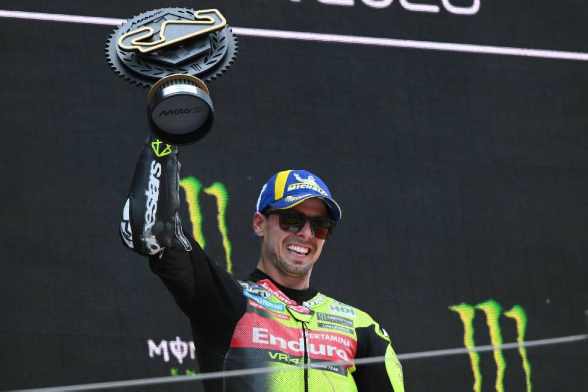TOPSHOT - Team Pertamina Enduro VR46 Racing Team's Fabio Di Giannantonio celebrates on the podium after winning the 2026 Catalunya Moto GP Grand Prix at the Catalunya racetrack in Montmelo, near Barcelona, on May 17, 2026. (Photo by JOSE JORDAN / AFP)