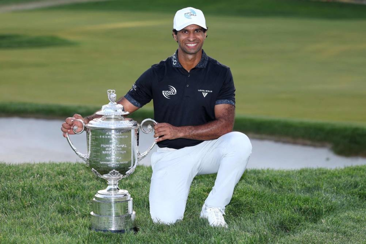 Aaron Rai of England celebrates with The Wanamaker Trophy after victory in the PGA Championship at Aronimink Golf Club in Newtown, Pennsylvania. (AFP)