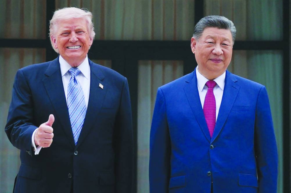 
US President Donald Trump, left, poses with Chinese President Xi Jinping during a visit to Zhongnanhai Garden in Beijing. (AFP) 